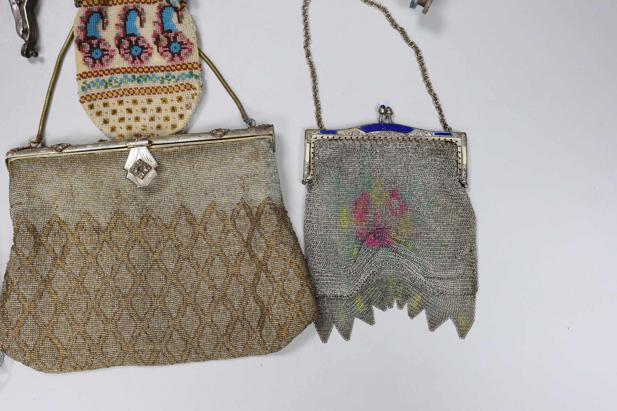 Two chain mail Edwardian handbags with enamelled frames, two 19th century beaded purses and a bag with ornate metal frames and two 20th century large metal bag frames (6)